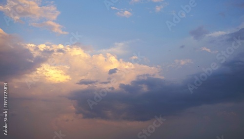 Beautiful sky view at sunset with scattered clouds, Bright blue sky This atmospheric view captures the natural beauty and dynamic lighting of the sky.