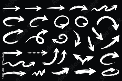 Collection of hand drawn white chalk arrows on a black background indicating direction and movement