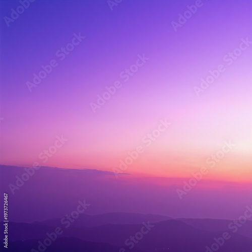 a purple twilight sky over distant layered mountains, soft clouds glowing as the last light fades behind the darkening peaks