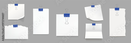 White paper sheets with blue binder clips