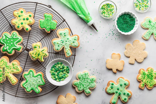 Shamrock shaped cookies decorated with icing and sprinkles for St. Patrick's Day