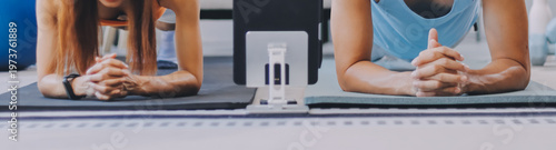 Support, teamwork and fitness couple doing workout training, challenging exercise for endurance, strength and stamina in a gym. Active, fit man and woman giving support and motivation during pushup