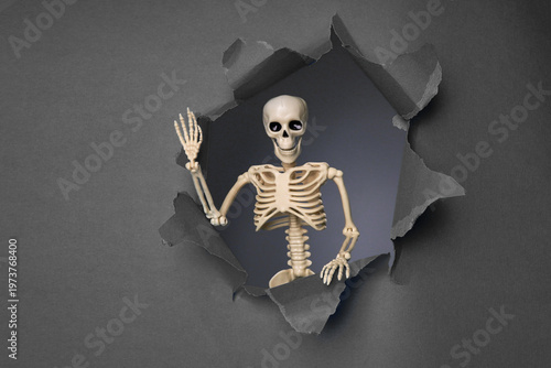 Skeleton Emerging from a Broken Wall with a Playful Gesture in a Dark Background Setting