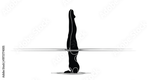 Professional female swimmer performing vertical underwater dive pose