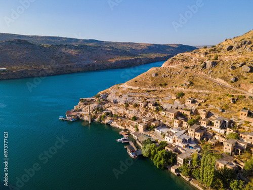 Photos Savasan Village in Halfeti, Sanliurfa, Türkiye, is partially submerged by the Euphrates due to the Birecik Dam, creating a striking scene of abandoned houses and rising waters