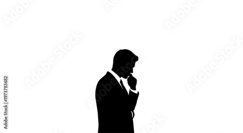 Silhouette of a thoughtful businessman contemplating a complex problem, deep in strategic consideration and future planning