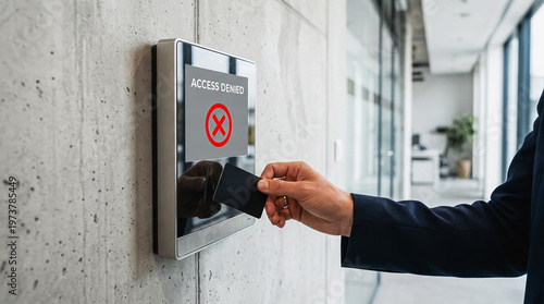 Access denied to an office , security scanner with Access Denied message, and an employee's hand with key card at building entrance. Copy space for text about blocking and internet disruption