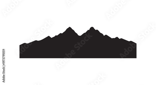 silhouette of mountain range against a clear sky at dusk or dawn