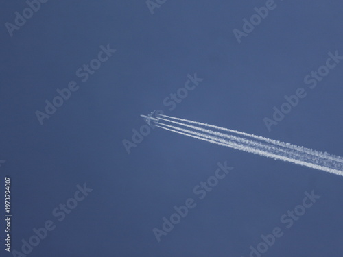 Quad jet aircraft leaving contrails behind 