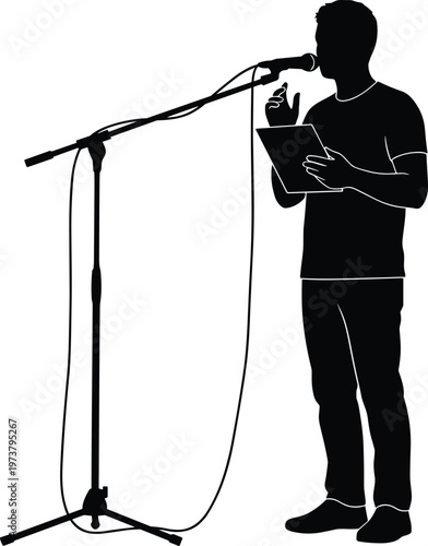 Man speaking into microphone at stand holding tablet computer during presentation.