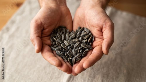 Heart shape made from natural grains on wooden surface showing healthy eating and love for organic food