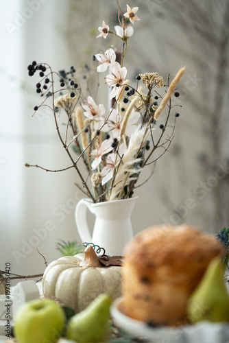 Easter bread with eggs and spring decoration, cozy rustic still life