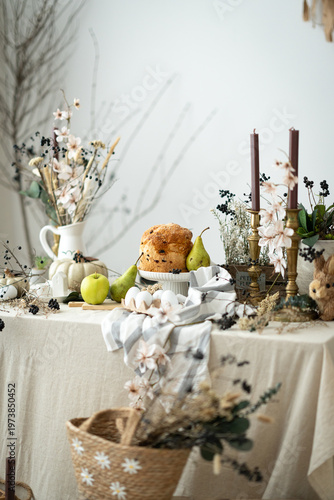 Easter bread with eggs and spring decoration, cozy rustic still life