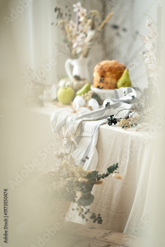 Easter bread with eggs and spring decoration, cozy rustic still life