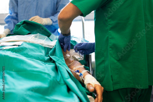 Medical professional giving intravenous therapy to patient