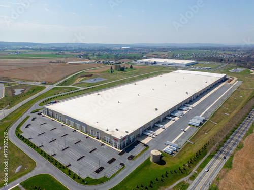 Aerial view of a large modern industrial warehouse and distribution center
