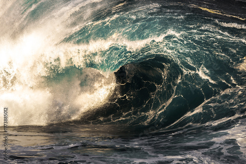 Large ocean wave breaking over a reef during heavy swell on the South Coast, New South Wales, Australia.