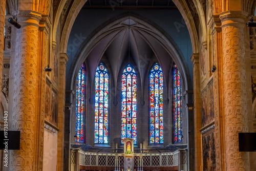 Cuadro en lienzo Multicolored stained glass windows near the altar in a Catholic church in German