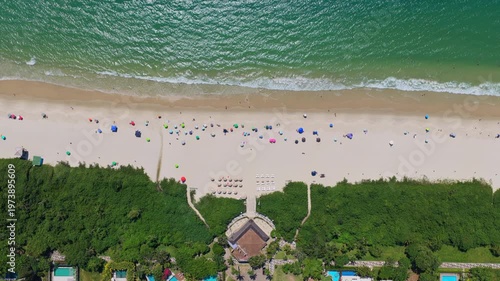 Summer day at Jurere Internacional beach with colorful umbrellas, Florianopolis, Brazil.