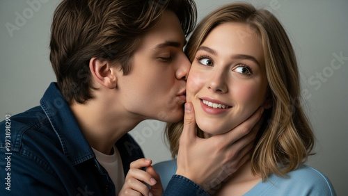 Affectionate Moment - Man Kisses Womans Cheek, Expressing Love and Intimacy.