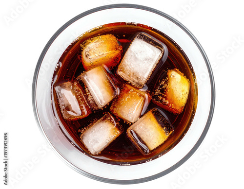 Top-down view of a glass with dark, bubbly liquid and ice cubes