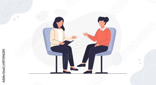 Two women in a therapy session, one taking notes, discussing issues