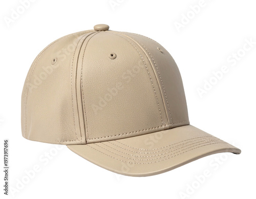 A beige baseball cap with a curved brim, on a dark background