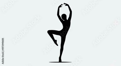 Elegant silhouette of a ballerina gracefully dancing with arms raised
