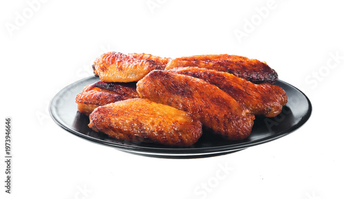 black plate of fried bbq chicken wings isolated on white background.