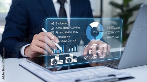 A businessman analyzing financial data on a digital tablet at his desk