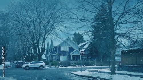 City Road With Passing Cars In Snowfall
