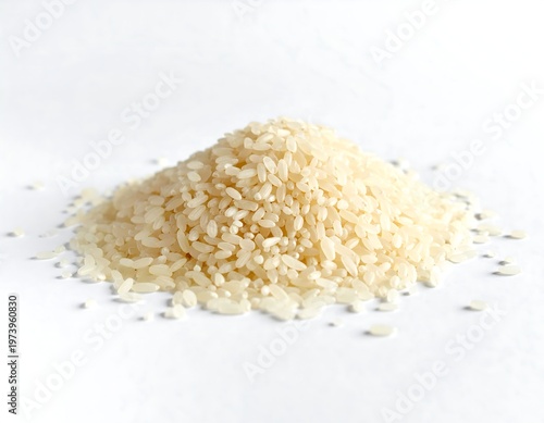 A small pile of light-colored grains on white surface