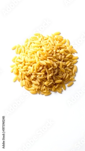 A small pile of yellow rice grains on a white background (1)