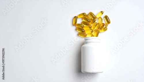 A white bottle lying on its side with yellow capsules spilling out