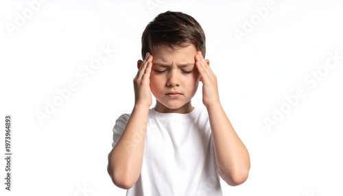 A young boy with his hands on his temples