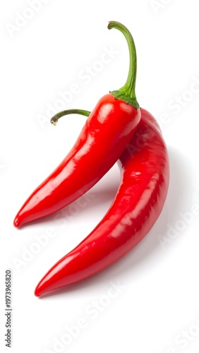 Two red chili peppers on white background
