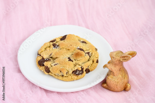 Canvas Print Celebrate Easter holiday with a large gourmet chocolate chip cookie with gold de