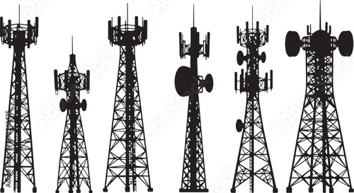Cell towers with antennas and satellite dishes in silhouette