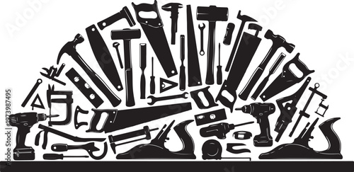Collection of various black tools on workbench surface