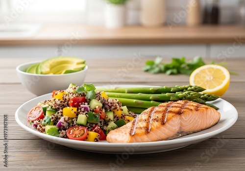 Grilled salmon with quinoa salad and steamed asparagus on a plate
