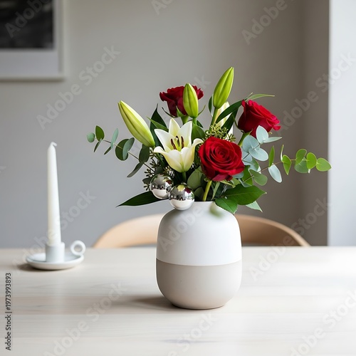 Serene floral arrangement with roses and lilies on a modern table