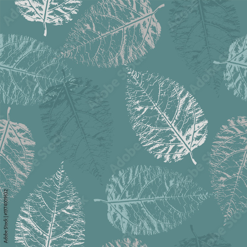 A seamless pattern featuring detailed silver leaf prints against a solid muted teal background