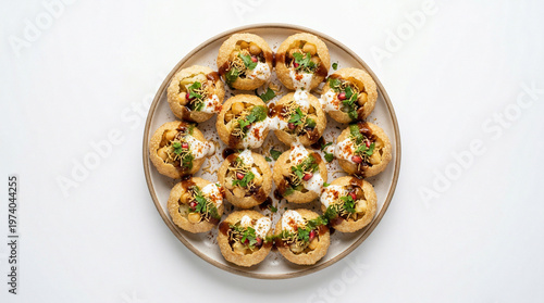 Obraz na plátně Delicious indian street food snack dahi puri or sev puri served on a white plate