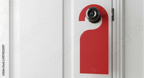 Close-up of a red Do Not Disturb sign hanging on a white door.