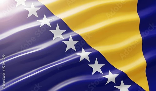 A close-up view of the national flag of Bosnia and Herzegovina, featuring its distinctive blue, yellow, and white star design, waving gently in the light.
