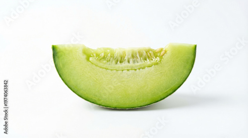 A slice of fresh green melon on a white background