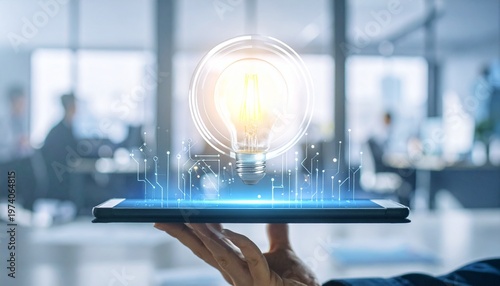 Hand holding digital tablet projecting a glowing light bulb, representing innovative business ideas, technology solutions, and creative problem-solving