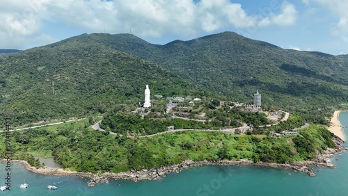 Linh Ung Pagoda, Son Tra Peninsula, Da Nang, Vietnam – 4K aerial drone footage of Buddhist temple, Lady Buddha statue, coastal mountains, tropical bay.