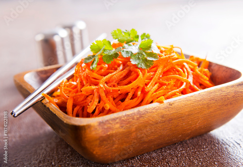 Carrot salad. French Grated Carrot Salad. Shredded carrot with garlic and black pepper