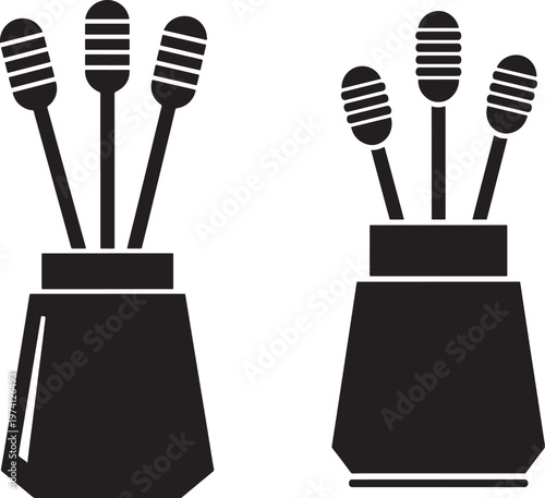 Two black silhouette icons of a vase with diffuser sticks or reeds inside.